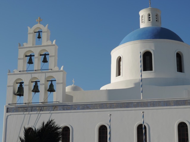 Oia is known for the white walls and blue domed churches...